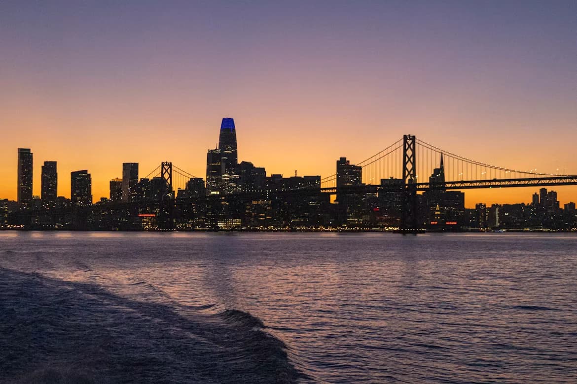 City skyline and bridges at dusk over the water